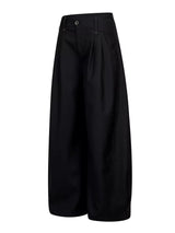 Men's high-waisted wide-leg pleated casual pants in neutral fabric, featuring a relaxed fit and classic style.