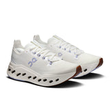 On Cloudsurfer Max women's road running shoes in Ivory and Nimbus with breathable mesh upper and cushioned sole.