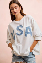 French terry top with 4th of July USA letter patchwork design by Trendsi, featuring patriotic red, white, and blue accents.