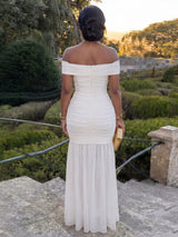 Off-shoulder ruched mermaid maxi dress by Trendsi, featuring a fitted bodice, flowing skirt, and elegant off-shoulder design.