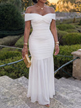 Off-shoulder ruched mermaid maxi dress by Trendsi featuring a fitted silhouette and elegant design.