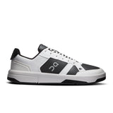 On THE ROGER Clubhouse men's tennis shoes with white and blue design, featuring breathable mesh and supportive rubber soles.