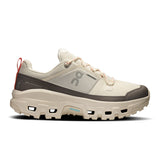 Women's On Cloudrock Low Waterproof hiking shoes with durable black exterior and supportive lacing, designed for outdoor adventures.