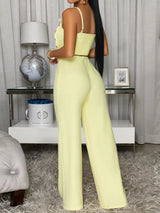 Decorative button smocked back cami and wide-leg pants set by Trendsi, featuring a stylish design with a fitted top and flowing pants.