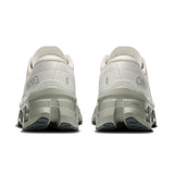 Women's On Cloudmonster 3 road running shoes with breathable mesh upper and cushioned sole for comfort and support.