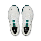 On THE ROGER Clubhouse Pro 2 men's tennis shoes with white and navy design, featuring cushioned soles and breathable mesh uppers.