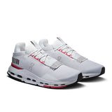 Men's On Cloudnova 2 active lifestyle sneakers in black and gray with cushioned soles and sleek design.