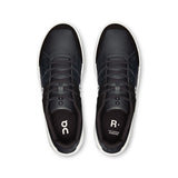 On THE ROGER Clubhouse men's tennis shoes in white with black accents, featuring breathable mesh and cushioned sole for comfort.