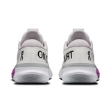 On THE ROGER Pro 3 women's tennis shoes in white and black with cushioned soles and sleek athletic design.