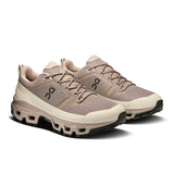 Men's On Cloudrock Low Waterproof hiking shoes with rugged sole and waterproof material, designed for outdoor trekking and trail walking.