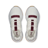 Women's On Cloudnova 2 active lifestyle sneakers in black and white, featuring sleek design and cushioned sole.