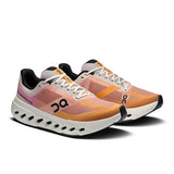 On Cloudsurfer Next women's road running shoes in gray and black with cushioned soles and breathable mesh upper.