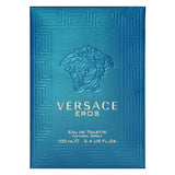 Versace Eros Eau de Toilette bottle with silver cap and blue liquid, showcasing the iconic Versace branding and elegant design.