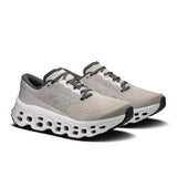 Women's On Cloudmonster 3 road running shoes with breathable mesh upper and cushioned sole for comfort and support.