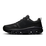 Men's On Cloudrock Low Waterproof hiking shoes with durable black upper and rugged rubber outsole for outdoor adventures.