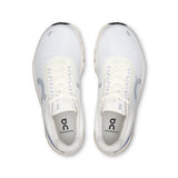 On Cloudmonster 2 women's road running shoes in Ivory and Nimbus color, featuring a sleek design and cushioned sole for comfort.