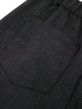 Men's high-waisted pleated wide-leg Capri pants by Trendsi, showing the relaxed fit and stylish design in a neutral fabric.