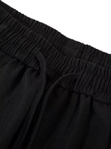 Men's wide-leg drawstring pants by Trendsi, featuring relaxed fit and comfortable waistband, shown in a neutral fabric.