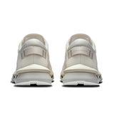 On Cloudzone women's active life sneakers in gray with cushioned soles and sleek design, ideal for running and active wear.