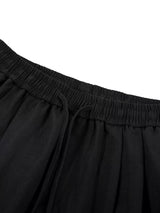 Men's wide-leg drawstring pants by Trendsi, featuring a relaxed fit and adjustable waistband, shown in a neutral color.
