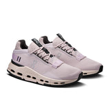 On Cloudnova 2 women's active life sneakers in black and white, featuring breathable mesh and cushioned soles for comfort.