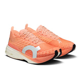 Women's On Cloudboom Strike road running shoes with breathable mesh upper and cushioned sole, designed for high-performance running.