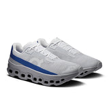 Men's On Cloudmonster Void active life sneakers with black and gray design, featuring cushioned soles and breathable mesh upper.