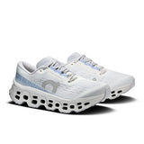 Women's On Cloudmonster 3 road running shoes with grey and black design, featuring cushioned soles and supportive structure.