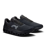Men's On Cloudmonster 1 active life running shoes with black and blue design, showcasing the breathable mesh upper and cushioned sole.