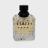 Valentino Donna Born In Roma Yellow Dream perfume bottle with bold yellow packaging and elegant design.
