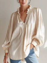Long sleeve blouse with frill notched collar, featuring a stylish design from Trendsi, displayed in a close-up shot.