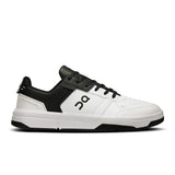 On THE ROGER Clubhouse men's tennis shoes with white and navy design, featuring breathable mesh and cushioned sole.