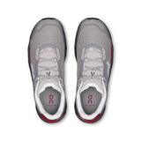 On Cloudmonster Void men's active lifestyle shoes in black with orange accents, featuring a cushioned athletic design and breathable upper.