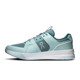 On THE ROGER Clubhouse Pro 2 men's tennis shoes with white and blue design, featuring supportive sole and breathable upper.