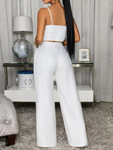Decorative button smocked back cami and wide-leg pants set by Trendsi, featuring a stylish, coordinated outfit with a fitted top and flowy pants.