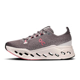On Cloudsurfer Max women's road running shoes in pink and black, featuring cushioned soles and breathable mesh uppers.