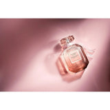 Victoria's Secret Bombshell Seduction perfume bottle with elegant design and floral accents, displayed on a neutral background.