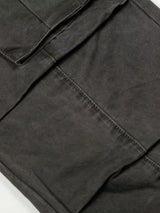 Men's vintage washed cargo pants in olive green with multiple pockets and relaxed fit, displayed on a neutral background.
