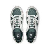 On THE ROGER Clubhouse men's tennis shoes with white and blue design, featuring cushioned soles and breathable mesh uppers.