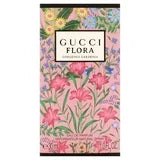 Gucci Flora Gorgeous Gardenia 1 oz Eau de Parfum spray bottle with floral design and elegant packaging.