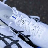 Unisex ASICS Metaspeed Sky Tokyo road racing shoes in white and cobalt burst with sleek design and lightweight construction.