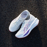 Women's ASICS Sonicblast Tokyo tempo trainers in vibrant colors, featuring breathable mesh and supportive design for running.