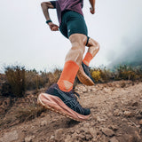 Men's ASICS Blazeblast trail running shoes in black with orange accents, featuring durable mesh uppers and rugged outsole.