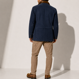 Men’s suede winter coat by Zexov featuring a stand collar and smart casual style, shown in a close-up of the jacket's fabric and design.