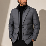 Men's lightweight quilted puffer jacket by Zexov, shown in navy with a front zipper and stand collar, suitable for cold weather.