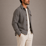 Men’s Houndstooth shirt jacket by Zexov, featuring classic black and white houndstooth pattern, long sleeves, and button closure.