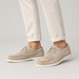 Men’s suede loafers by Zexov featuring a smart casual lace-up design, shown in a close-up of the tan footwear.