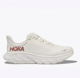 Women's Hoka Arahi 7 running shoes in blanc de blanc with rose gold accents, B-width, featuring breathable mesh and cushioned sole.