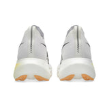 Unisex ASICS Megablast tempo trainers in white and orange glow, with breathable mesh upper and cushioned sole.