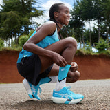 Unisex ASICS Metaspeed Sky Tokyo road racing shoes in white with blue accents, designed for high-performance running.